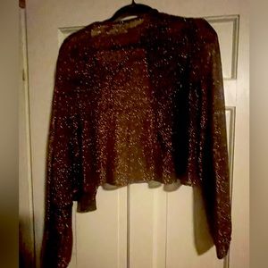 No brand enclosed .. it says dry clean only .. Beautiful sheer jacket